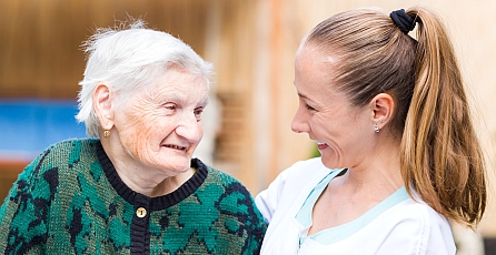 Image of a nurse talking to a old lady